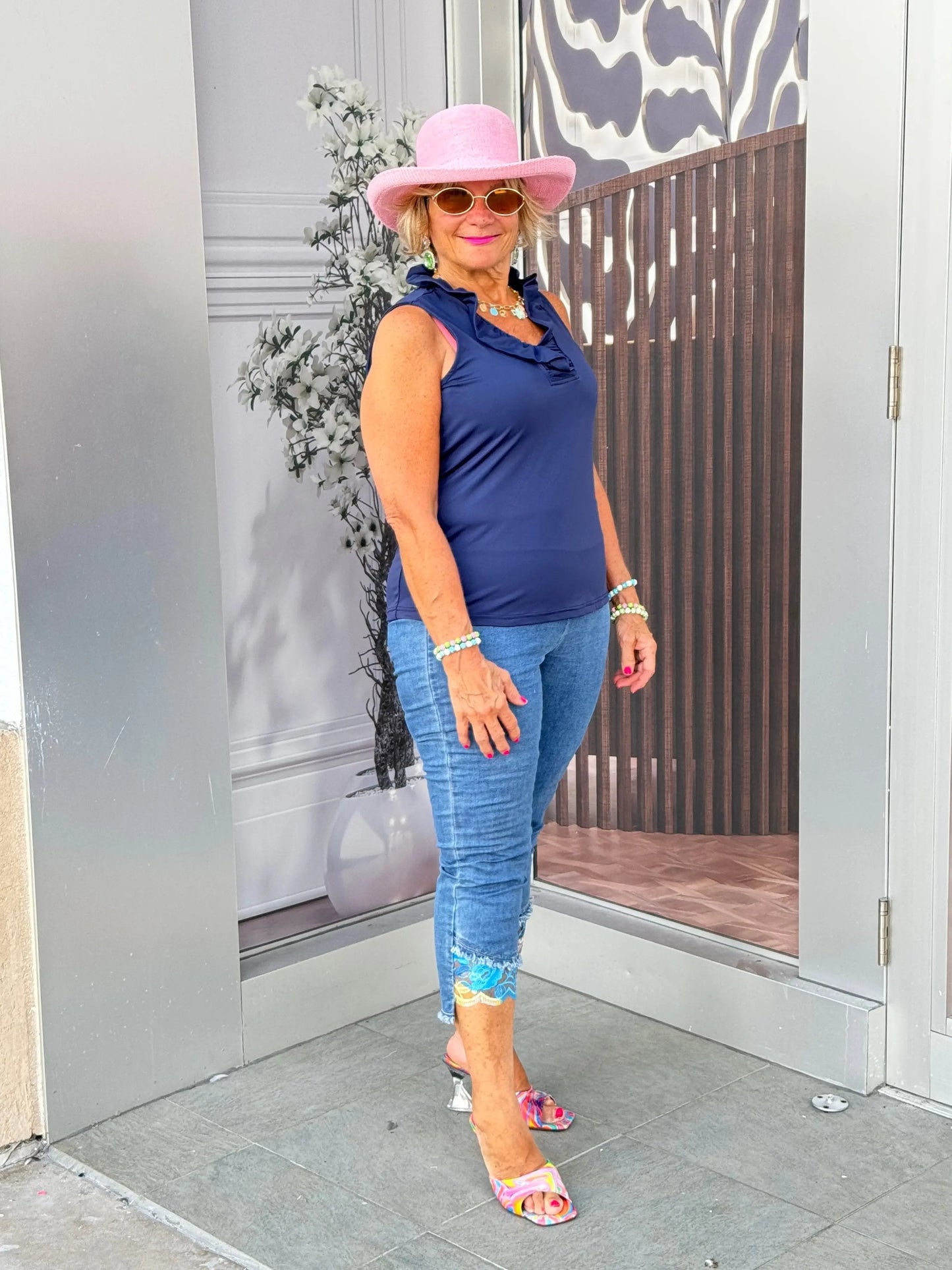 NAVY SLEEVELESS RUFFLE TOP